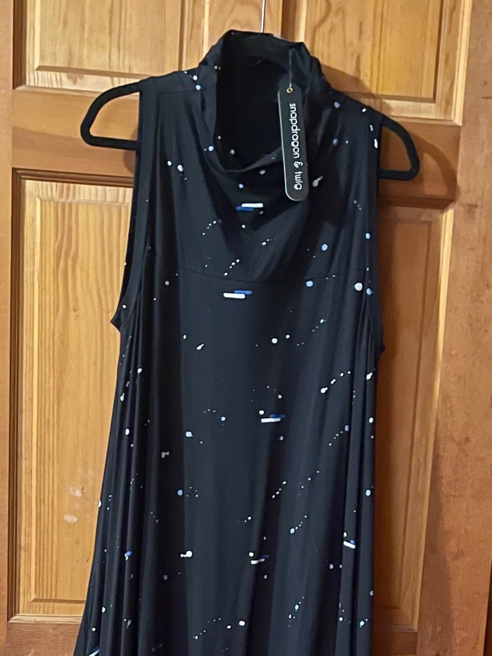 BLACK PRINT SLEEVELESS DRESS WITH ASYMMETRIC HEMLINE